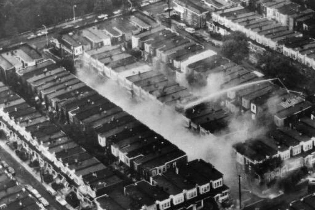 An aerial photo of the damaged rowhomes after the MOVE bombing