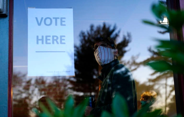 Voter waiting in line at a polling place.