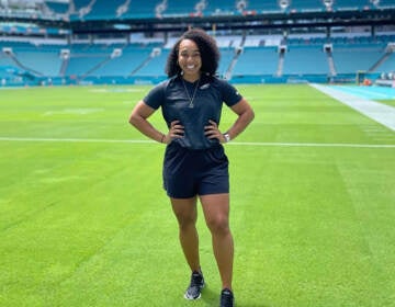 Autumn Lockwood stands on a football field.