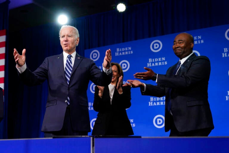 Biden stands onstage.