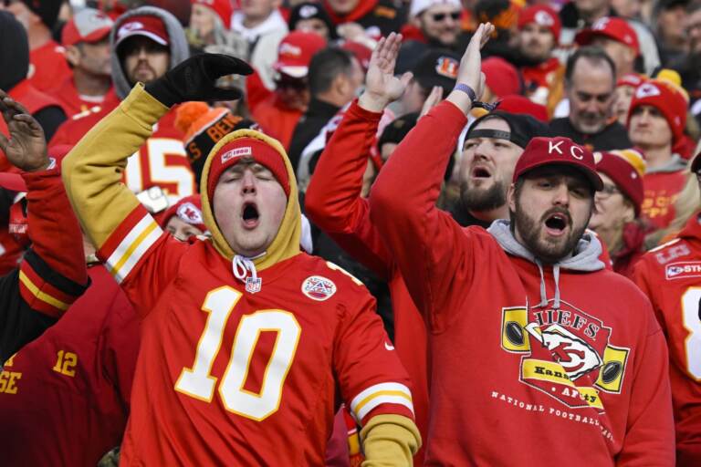 A group of fans in Chiefs gear do the 