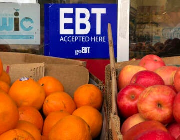 A sign noting the acceptance of electronic benefit transfer (EBT) cards, which SNAP beneficiaries use to pay for food, is displayed at a grocery store in 2019 in Oakland, Calif. SNAP emergency allotments are ending after this month and have already ended in some parts of the country.