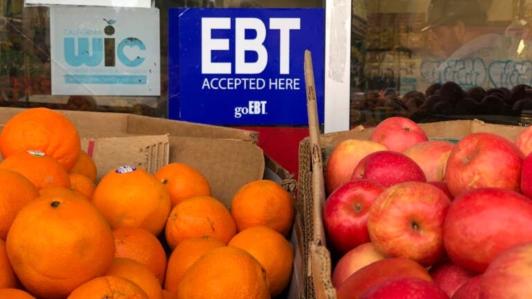 A sign noting the acceptance of electronic benefit transfer (EBT) cards, which SNAP beneficiaries use to pay for food, is displayed at a grocery store in 2019 in Oakland, Calif. SNAP emergency allotments are ending after this month and have already ended in some parts of the country.