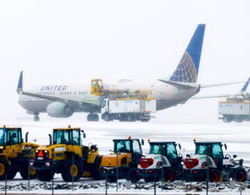 A United Airlines flight is de-iced before takeoff during a winter storm at Denver International Airport on Wednesday in Denve