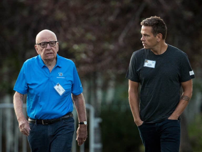 In a $1.6 billion defamation suit, Dominion Voting Systems argues that Fox Corp. bosses Rupert Murdoch (left) and Lachlan Murdoch (right) were deeply involved in shaping editorial decisions at Fox News. (Drew Angerer/Getty Images)