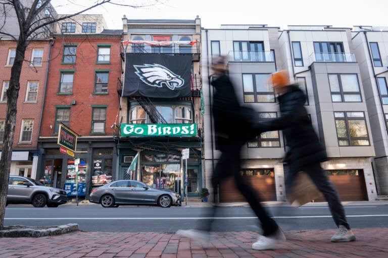 An Eagles banner hangs on a building in Philadelphia