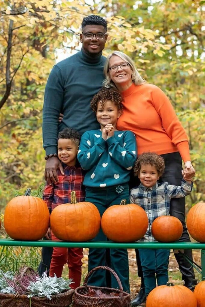 Alleyne and Poladko celebrate and their children at a pumpkin patch in Poland