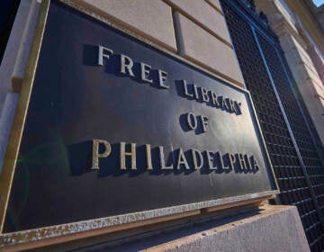 A close-up of a sign that reads Free Library of Philadelphia.