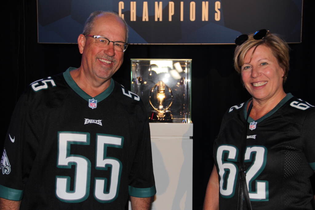 Mike Richardson and Joanne Edwards pose with the Eagles' NFC Championship trophy.
