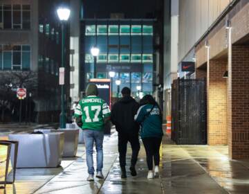 Sad fans walk home after the Philadelphia Eagles lose the Super Bowl