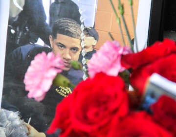 A photo of Christopher Fitzgerald placed a memorial set up next to the place he was killed, near 17th Street and Montgomery Avenue. (Cory Sharber/WHYY)