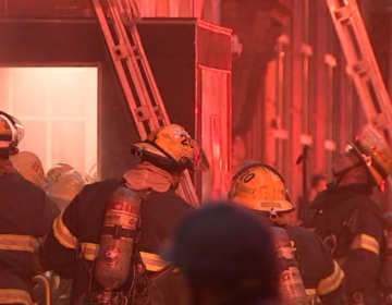 Firefighters work the scene of a kitchen fire at Tequilas restaurant in Center City