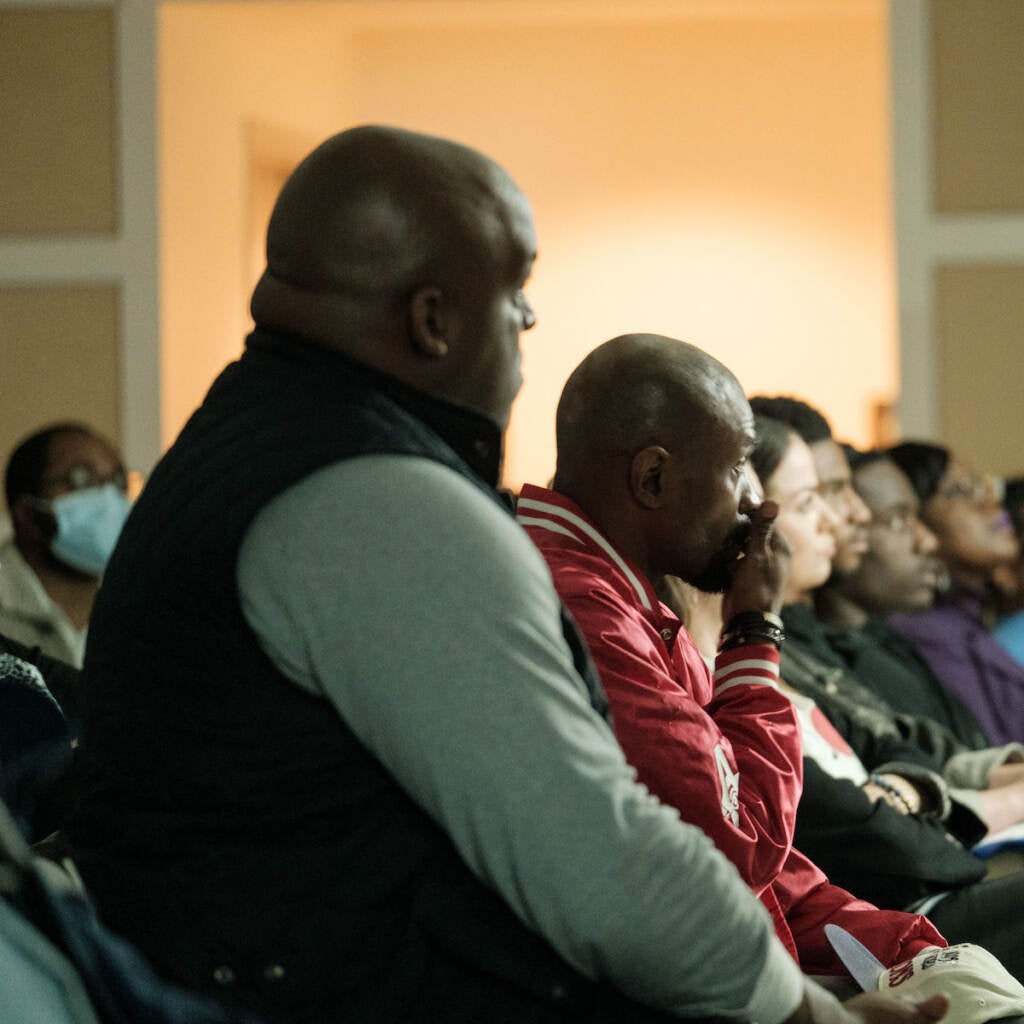 A close-up of members of an audience.