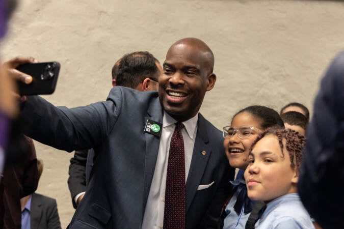 Philadelphia mayoral candidate Derek Green takes a selfie with Gloria Casarez Elementary students