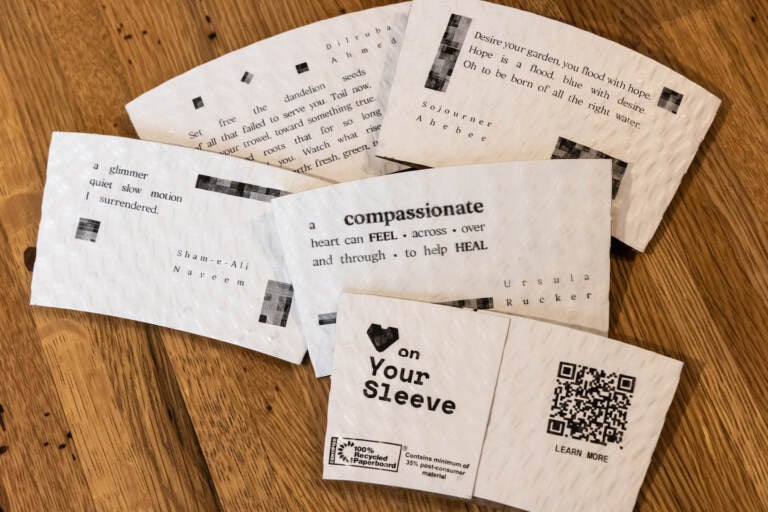 Through April 2023, Elixr Coffee is printeing poems on their beverage sleeves. (Kimberly Paynter/WHYY)