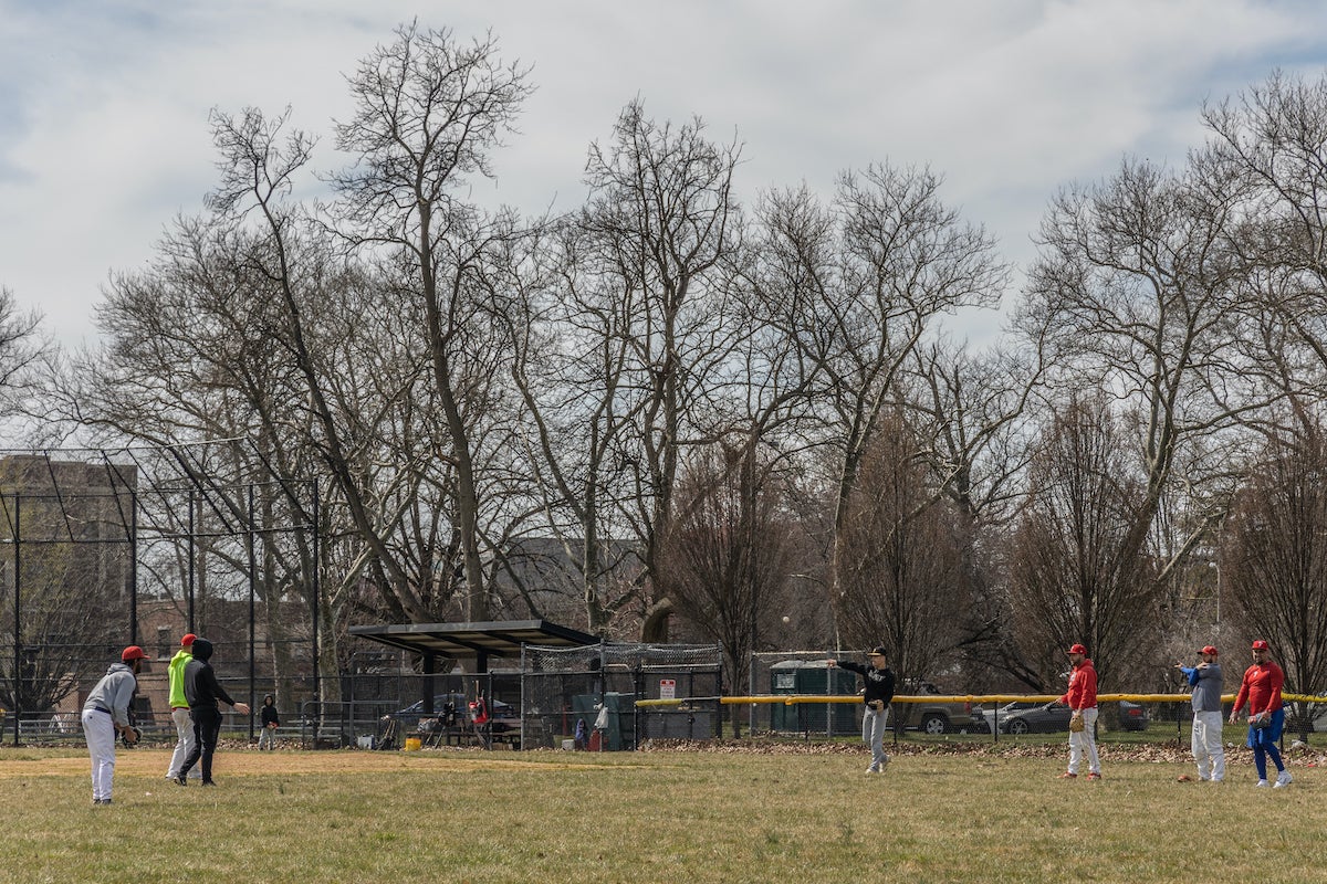 Baseball practice took place a few days before the spring equinox in Hunting Park. (Kimberly Paynter/WHYY)