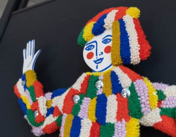 A tufted carnival figure is shown.