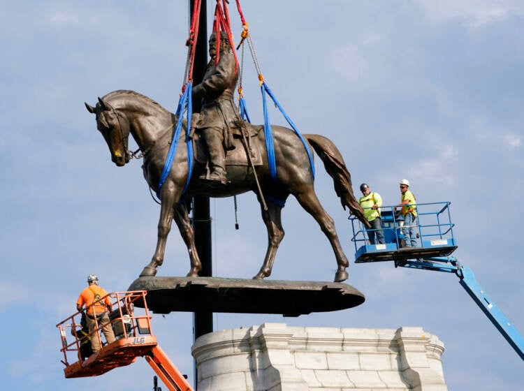 Crews remove one of the country's largest remaining monuments to the Confederacy, a towering statue of Confederate General Robert E. Lee on Monument Avenue in Richmond, Va., Wednesday, Sept. 8, 2021. (AP Photo/Steve Helber, File)