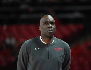 Temple head coach Aaron McKie walks down the sideline during the first half of an NCAA college basketball game against Houston