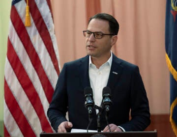 Gov. Josh Shapiro speaks at a podium.