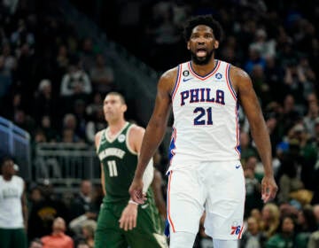 Philadelphia 76ers' Joel Embiid (21) reacts after making a basket during the second half of an NBA basketball game against the Milwaukee Bucks,