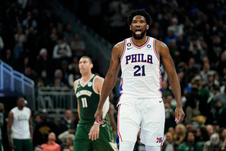 Philadelphia 76ers' Joel Embiid (21) reacts after making a basket during the second half of an NBA basketball game against the Milwaukee Bucks,