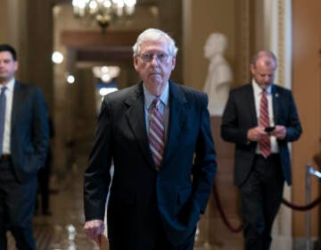 Senate Minority Leader Mitch McConnell, R-Ky., walks to the chamber