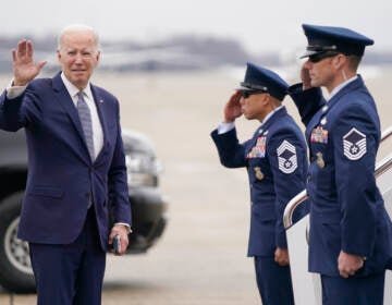 President Joe Biden waves before boarding Air Force One