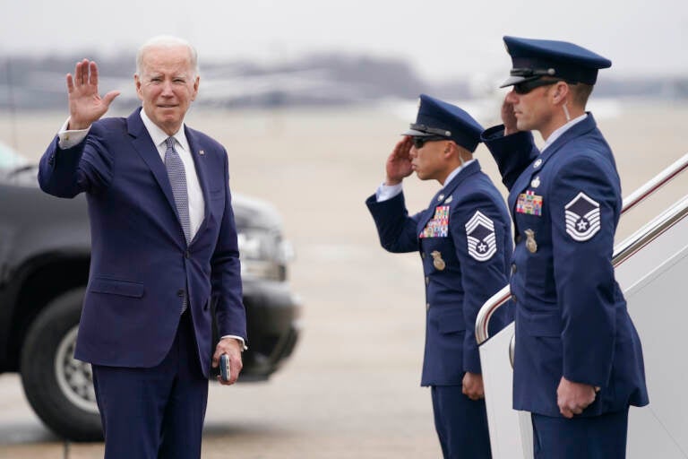 President Joe Biden waves before boarding Air Force One