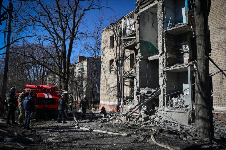 Ukrainian Emergency Service rescuers work on a building damaged by shelling in Kramatorsk, Donetsk region, Ukraine