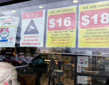 File photo: Hiring signs are displayed at a grocery store in Arlington Heights, Ill., Jan. 13, 2023. Employers are increasingly posting salary ranges for job openings, even in states where it's not mandated by law, according to analysts with employment sites Indeed, GlassDoor, and Monster. (AP Photo/Nam Y. Huh, File)