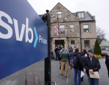 Customers and bystanders form a line outside a Silicon Valley Bank branch location