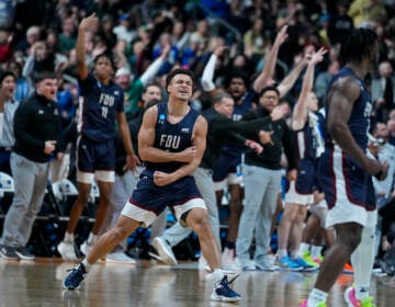 Fairleigh Dickinson guard Grant Singleton (4) celebrates after a basket against Purdue in the second half of a first-round college basketball game in the men's NCAA Tournament in Columbus, Ohio