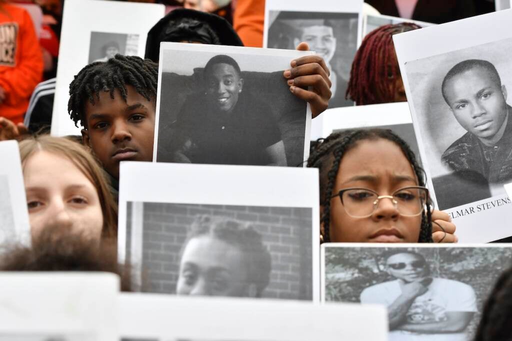 Students from Philadelphia hold photos of gun violence victims at a rally at the Pennsylvania Capitol pressing for stronger gun-control laws, Thursday, March 23, 2023, in Harrisburg, Pa. (AP Photo/Marc Levy)