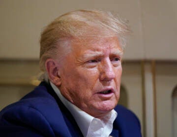 Former President Donald Trump speaks with reporters while in flight on his plane after a campaign rally at Waco Regional Airport, in Waco, Texas, Saturday, March 25, 2023, while en route to West Palm Beach