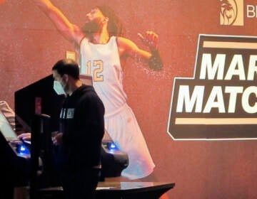A man makes a bet at a kiosk in the Borgata casino in Atlantic City NJ on March 19, 2021 at the start of the March Madness college basketball tournament