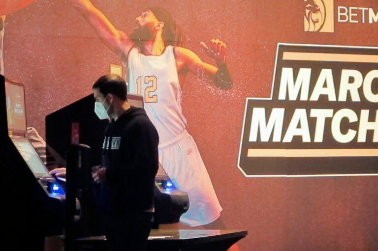 A man makes a bet at a kiosk in the Borgata casino in Atlantic City NJ on March 19, 2021 at the start of the March Madness college basketball tournament