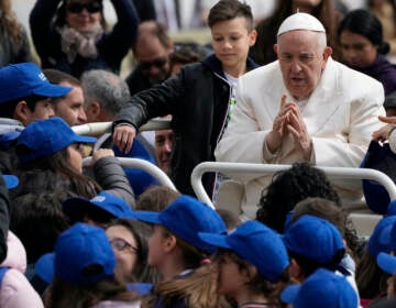 Pope Francis meets children at the end of his weekly general audience in St. Peter's Square, at the Vatican