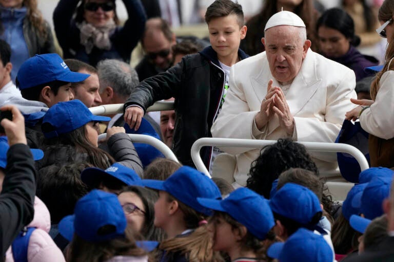 Pope Francis meets children at the end of his weekly general audience in St. Peter's Square, at the Vatican