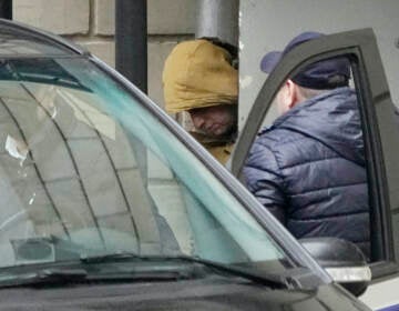 Wall Street Journal reporter Evan Gershkovich is escorted by officers from the Lefortovsky court to a bus, in Moscow,