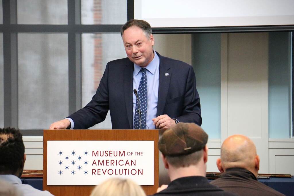 Scott Stephenson, president of the Museum of the American Revolution, speaks at a repatriation ceremony returning 50 stolen artifacts, mostly guns, to their rightful owners
