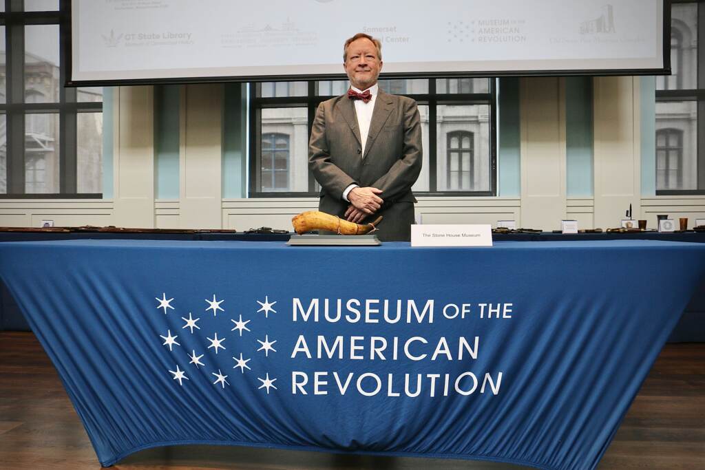 Tom Stockton, of the Stone House Museum in Belchertown, Mass., poses with a French and Indian War-era powder horn stolen from his museum 50 years ago