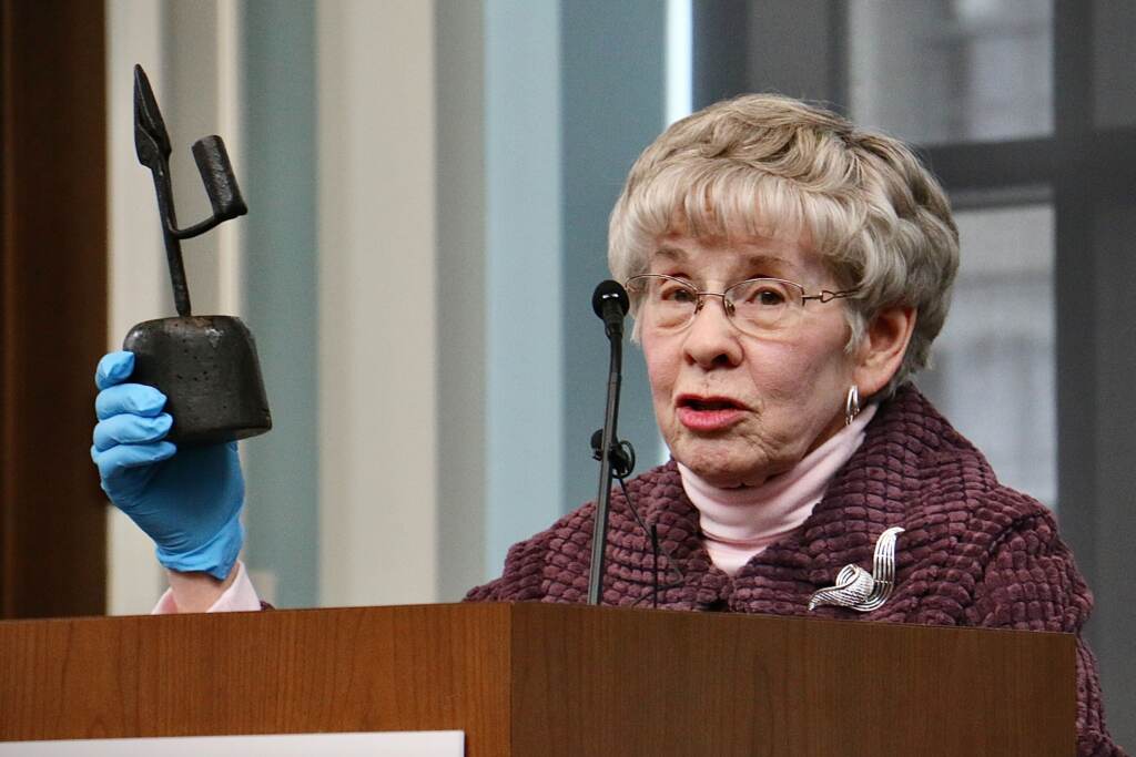 Irene Coffey of the Haverford Township Historical Society holds a rush light used in the early 1800s. The artifact, stolen from the society 50 years ago, was returned during a repatriation ceremony at the Museum of the American Revolution