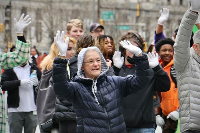 Amy Trachtenberg of Philadelphia warms up her jazz hands at Love Park, where the Office of Arts, Culture and the Creative Economy sponsored an effort to break the world record for most people doing jazz hands at once