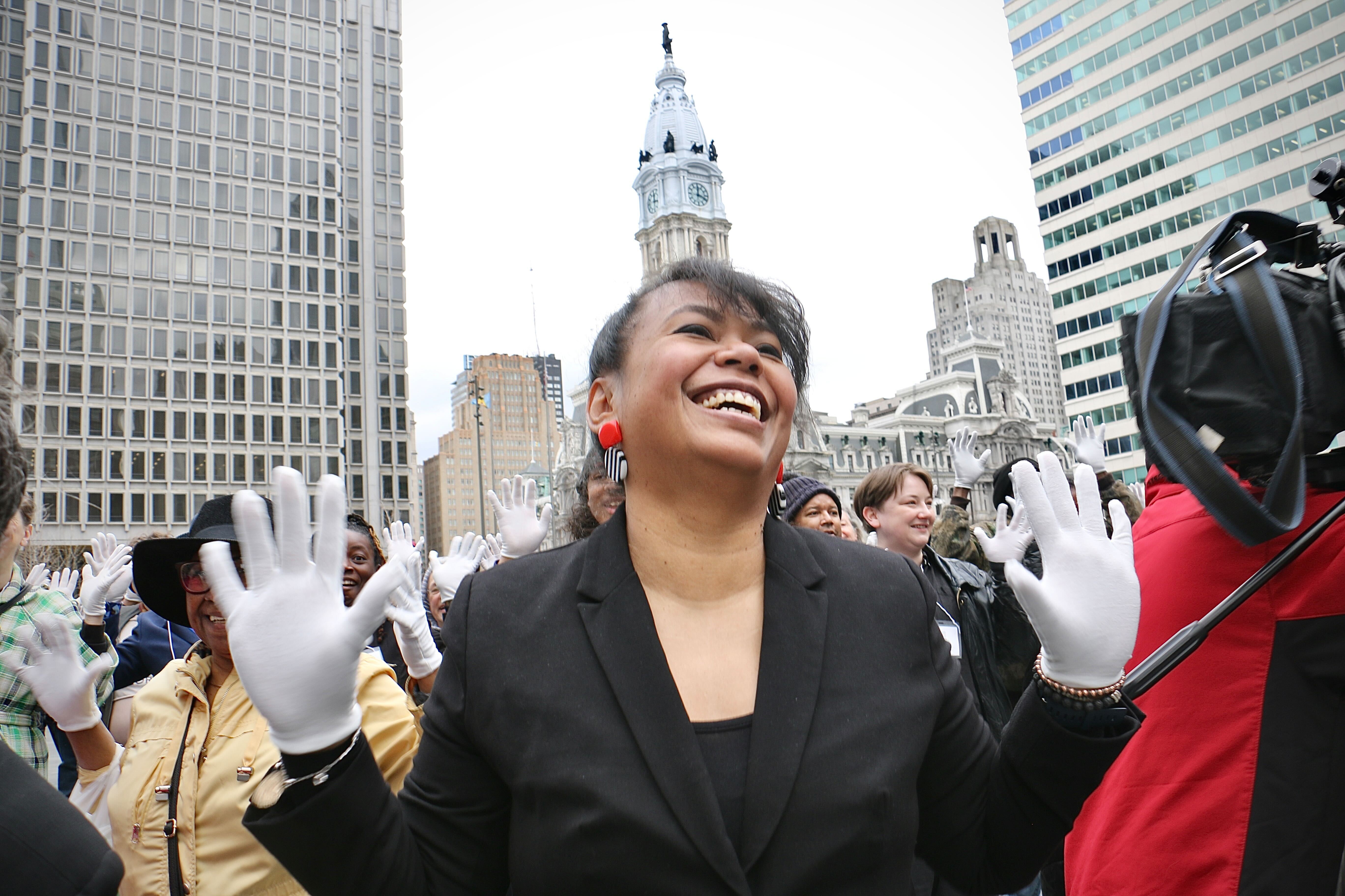 Philadelphians try to break the world record for most people doing jazz hands at once during the kickoff of the month-long Philly Celebrates Jazz event in Love Park