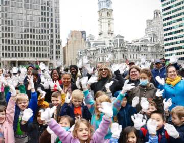 A sea of white gloves fill Love Park as Philadelphians try to break the world record for most people doing jazz hands at once