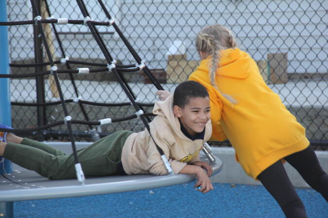 Kids were excited for the reopening of Glavin Playground on March 16, 2023, following a more than $3 million renovation plan. (Cory Sharber/WHYY)