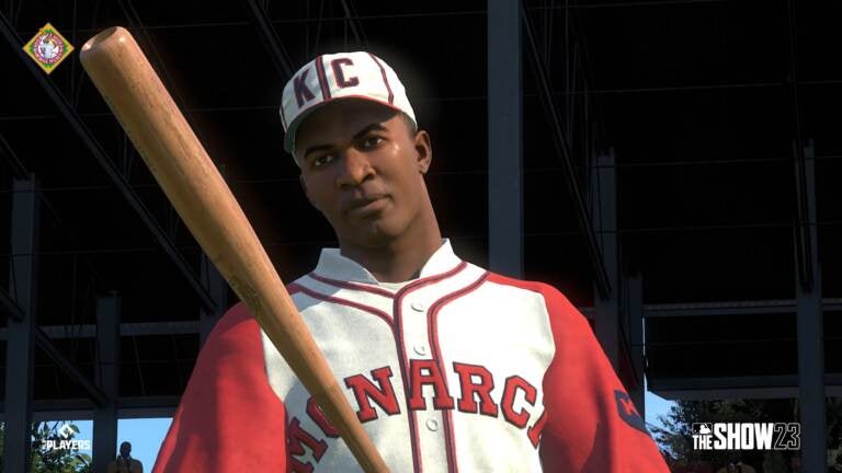 Untitled photo shows: Satchel Paige, in the Kansas City Monarchs uniform at  a baseball game]