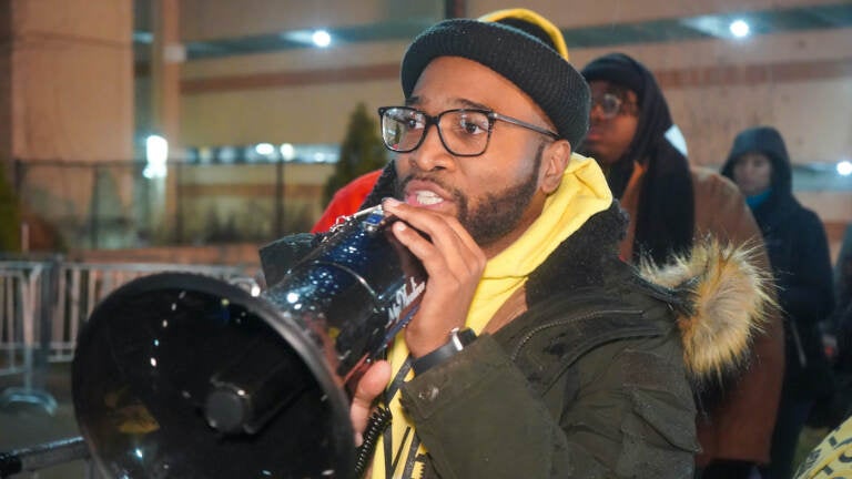 BLM Paterson Leader Zellie Thomas speaks to the crowd on Fri, March 10, 2023. (Tennyson Donyéa/WHYY)