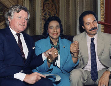 Randall Robinson, right, is pictured with Coretta Scott King and Sen. Edward Kennedy, D-Mass., after the Senate voted to override then-President Reagan's veto of tough new sanctions against South Africa in 1986. Robinson died Friday at 81.